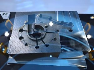 High precision metal 3D printed mold component on a build plate made with selective laser melting