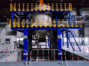 Large vertical vacuum heat treatment furnace used for aerospace alloy, titanium alloy, and stainless steel component processing with high temperature precision control.